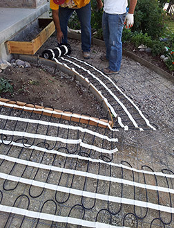 Installing heating cable in mats for heated driveway and sidewalk