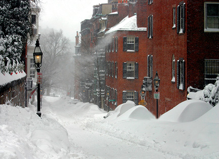 Snow accumulating on streets and roofs in Boston during blizzard