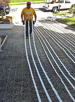 Installing radiant heat cable in mats