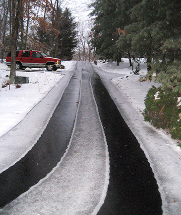 Long driveway with heated tire tracks