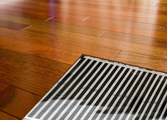 Heated hardwood floor with cutaway