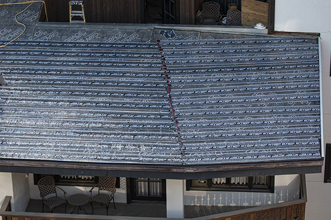Low-voltage roof heating system being installed