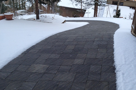 A residential heated driveway with pavers.
