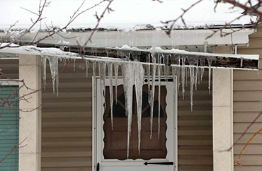 Home with damaged gutters.