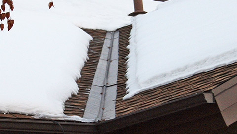 Low-voltage roof heating system installed in the valley and along the roof eave.