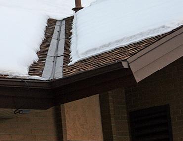 Low-voltage roof heating system installed to heat roof valley and edges