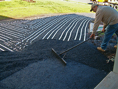 Heated asphalt driveway installation.