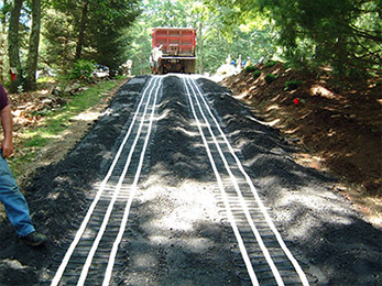 Asphalt heated driveway being installed.