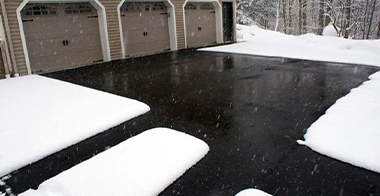 Heated driveway and walkways in asphalt.